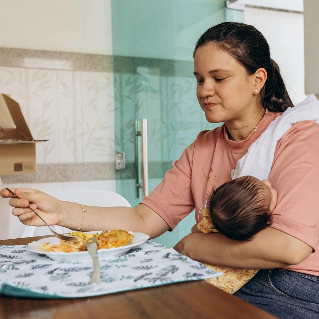 Breastfeeding parent supporting brain health through nutrition hydration and rest during postpartum period