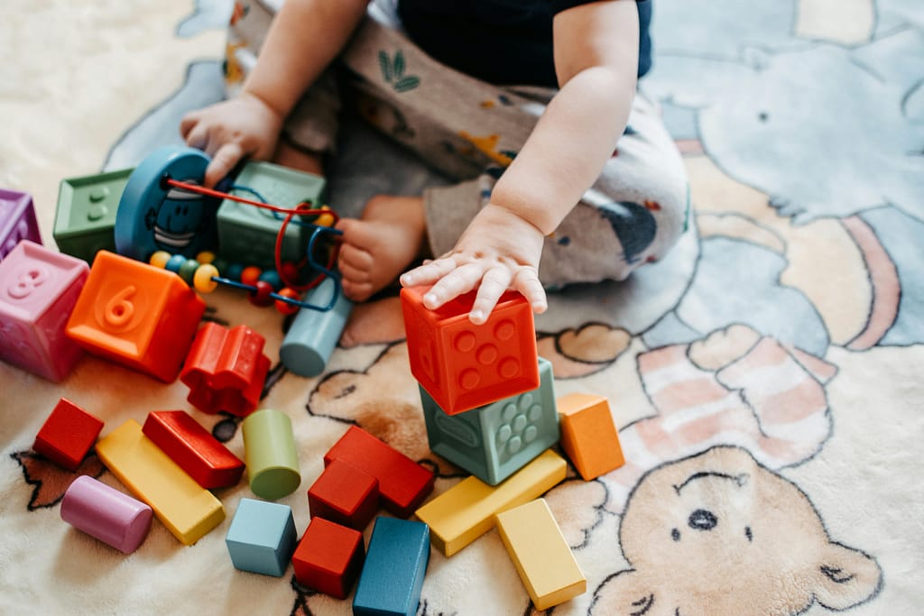 Spot 5 things you see, like your child's colorful toys